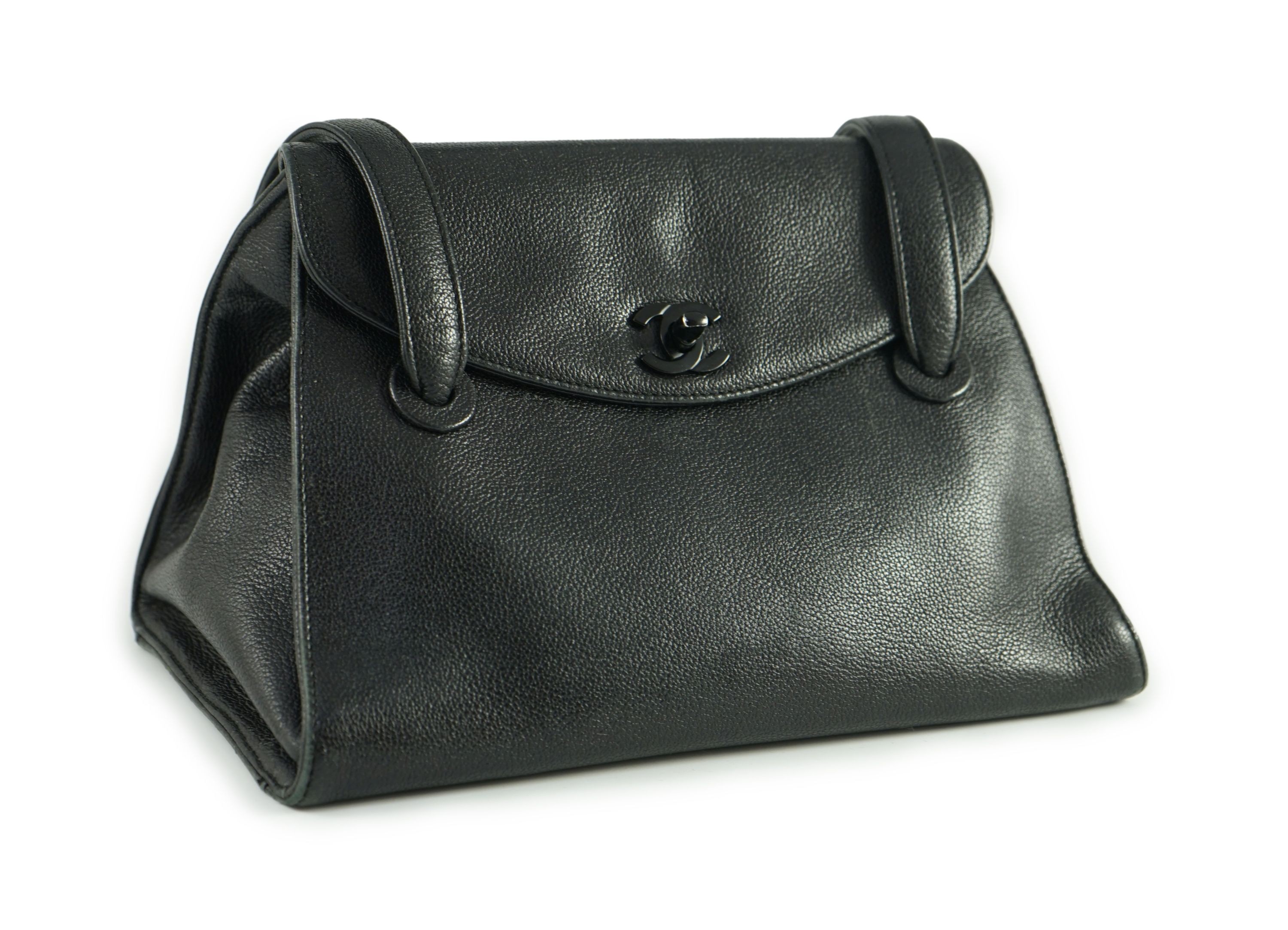 A black Chanel shoulder bag with two straps and Chanel logo lock